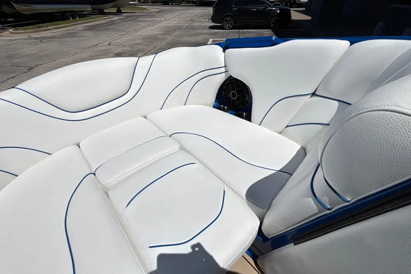 Slide: The Image of Luxurious white seating with blue accents in a 2026 MB B52 23 Alpha boat. - 51