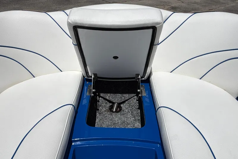 Slide: The Image of 2026 MB B52 23 Alpha boat interior with white seating and blue accents. - 56