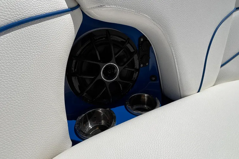 Slide: The Image of 2026 MB B52 23 Alpha boat interior with speaker and cup holders. - 59