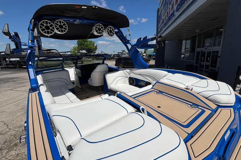 Slide: The Image of 2026 MB B52 23 Alpha boat with luxurious white seating and blue accents. - 9