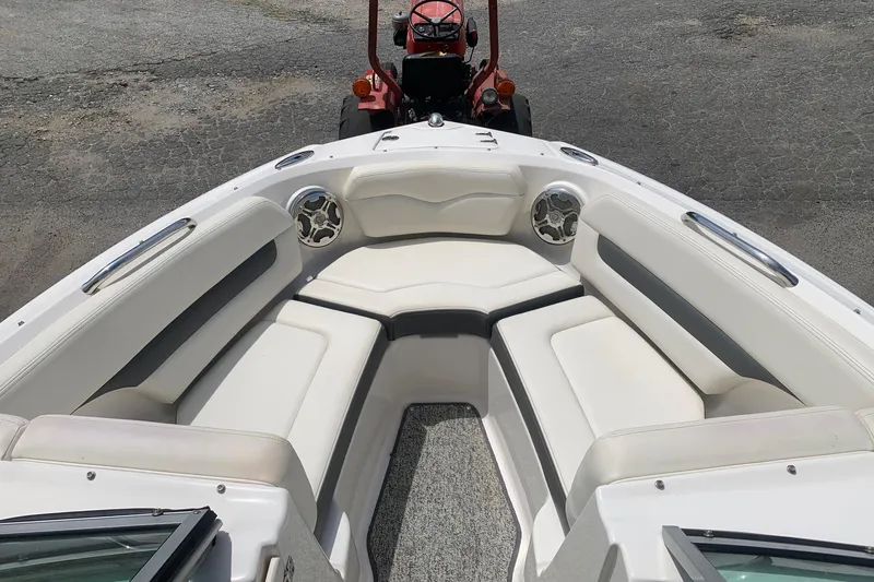 Slide: The Image of 2014 Chaparral 206 SSi boat interior with white seating and speakers. - 5