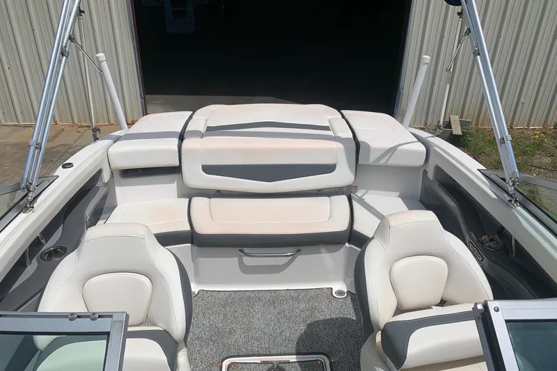 Slide: The Image of 2014 Chaparral 206 SSi boat interior with white seating and gray accents. - 8