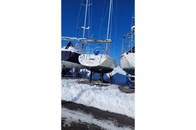Slide: The Image of Jeanneau Sun Odyssey 37 sailboat, 2004 model, in snowy boatyard. - 16