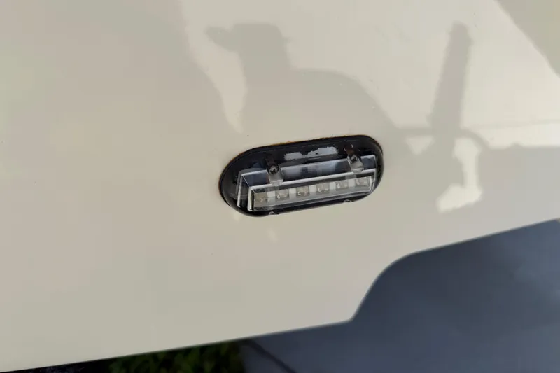 Slide: The Image of Close-up of a 2023 Carolina Skiff 21 LS boat light fixture. - 14
