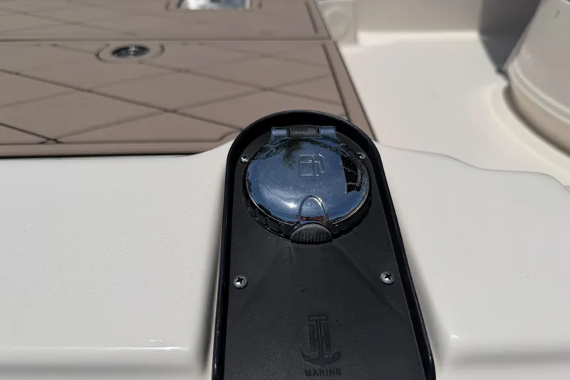 Slide: The Image of Fuel cap on 2023 Carolina Skiff 21 LS boat deck, featuring JL Marine branding. - 31