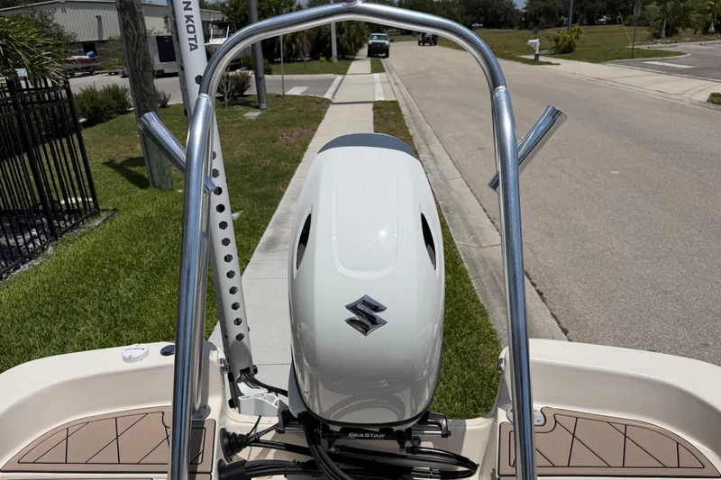 Slide: The Image of 2023 Carolina Skiff 21 LS boat with Suzuki outboard motor on a sunny street. - 36