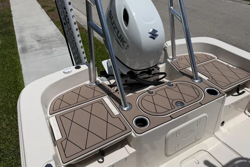 Slide: The Image of 2023 Carolina Skiff 21 LS boat with Suzuki outboard motor and deck features. - 37