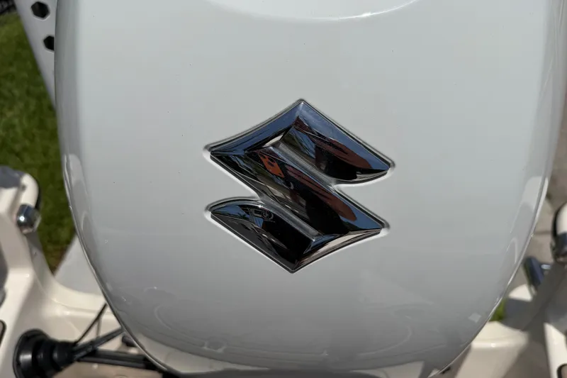 Slide: The Image of Suzuki logo on a 2023 Carolina Skiff 21 LS boat engine. - 48