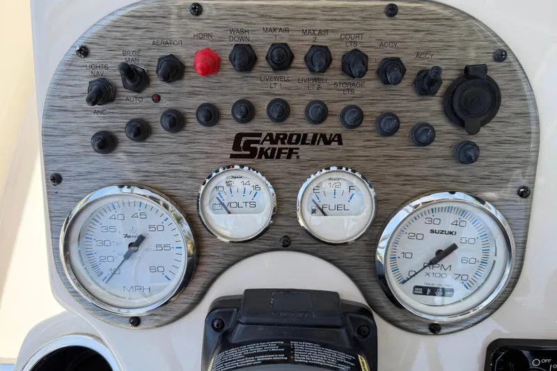 Slide: The Image of Dashboard of a 2023 Carolina Skiff 21 LS boat with gauges and controls. - 50