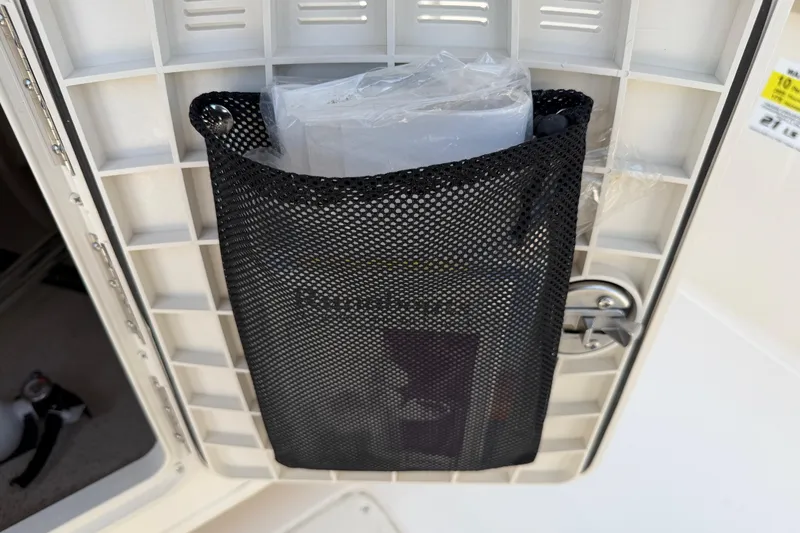 Slide: The Image of Mesh storage pocket on a 2023 Carolina Skiff 21 LS boat interior. - 58