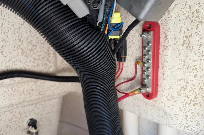 Slide: The Image of Electrical wiring and connections inside a 2023 Carolina Skiff 21 LS boat. - 60