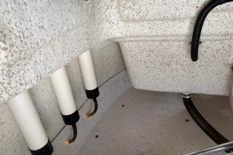 Slide: The Image of Interior view of 2023 Carolina Skiff 21 LS boat showing drainage pipes and textured surface. - 61