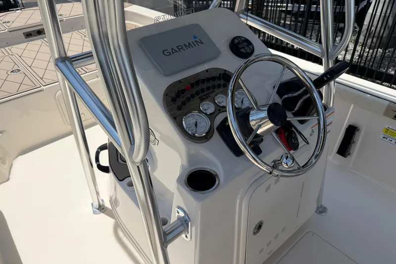 Slide: The Image of 2023 Carolina Skiff 21 LS boat console with Garmin navigation and steering wheel. - 63