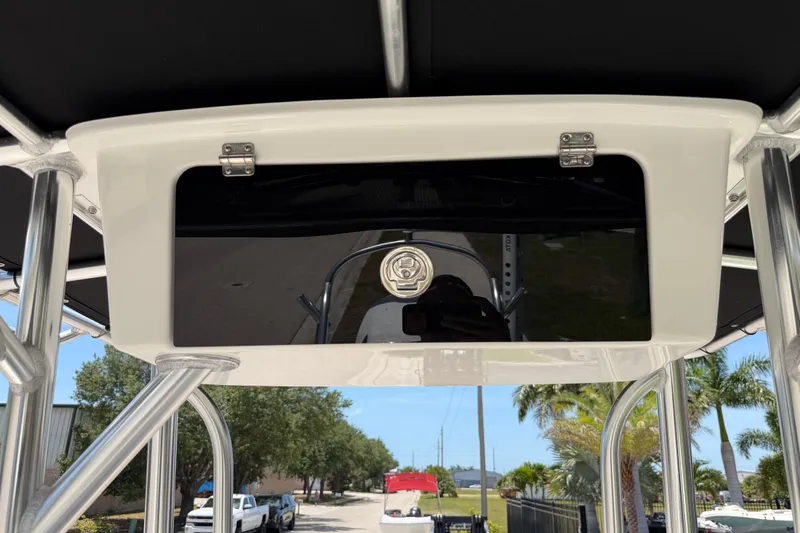 Slide: The Image of 2023 Carolina Skiff 21 LS boat console with storage compartment, viewed from below. - 64