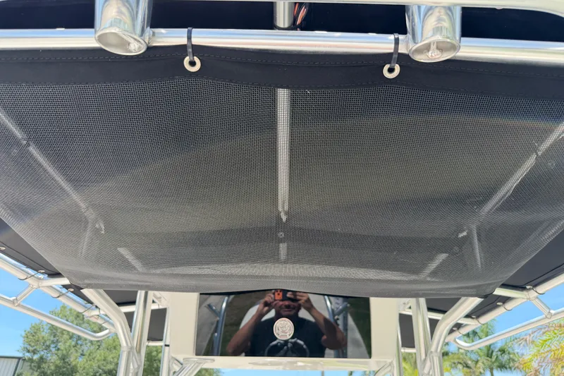 Slide: The Image of 2023 Carolina Skiff 21 LS boat canopy with metal frame and mesh cover. - 65