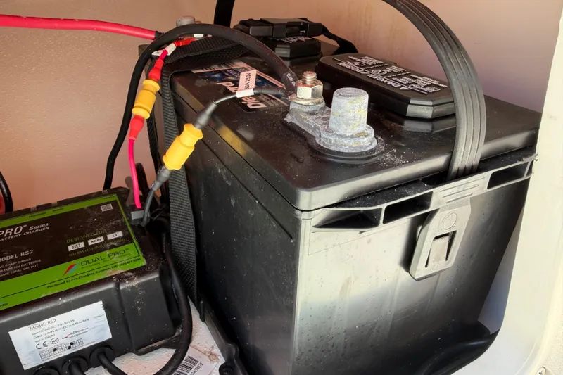 Slide: The Image of Battery and charger setup in 2023 Carolina Skiff 21 LS boat. - 83