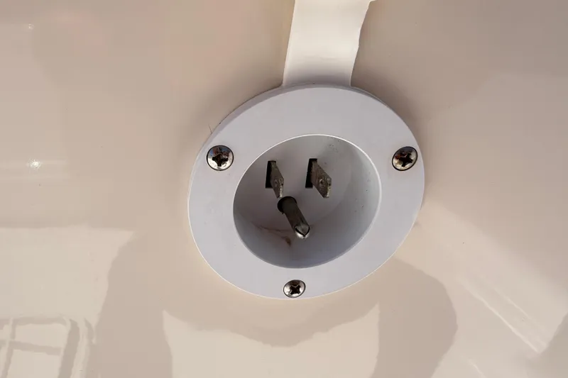 Slide: The Image of 2023 Carolina Skiff 21 LS boat power socket detail with white finish. - 87