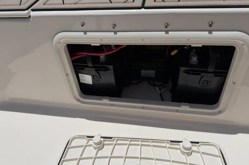 Slide: The Image of Battery compartment of 2023 Carolina Skiff 21 LS boat, showcasing internal components. - 88