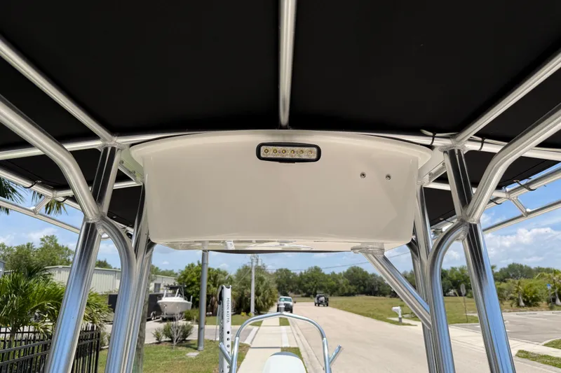 Slide: The Image of 2023 Carolina Skiff 21 LS boat T-top with integrated lighting, showcasing sleek design. - 89