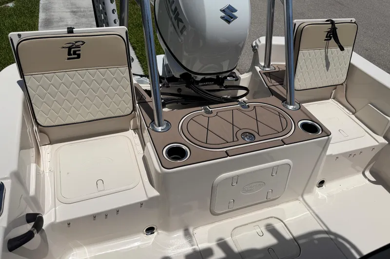 Slide: The Image of 2023 Carolina Skiff 21 LS boat interior with Suzuki engine and seating. - 90