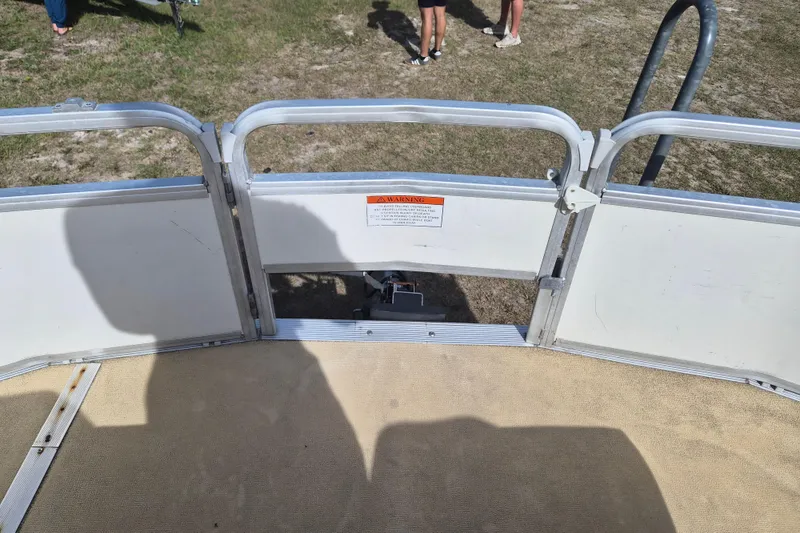 Slide: The Image of 2004 Sun Tracker Fishin' Barge 20 DLX pontoon boat with open gate and shadows. - 13