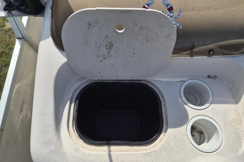 Slide: The Image of Open storage compartment on 2004 Sun Tracker Fishin' Barge 20 DLX boat. - 18