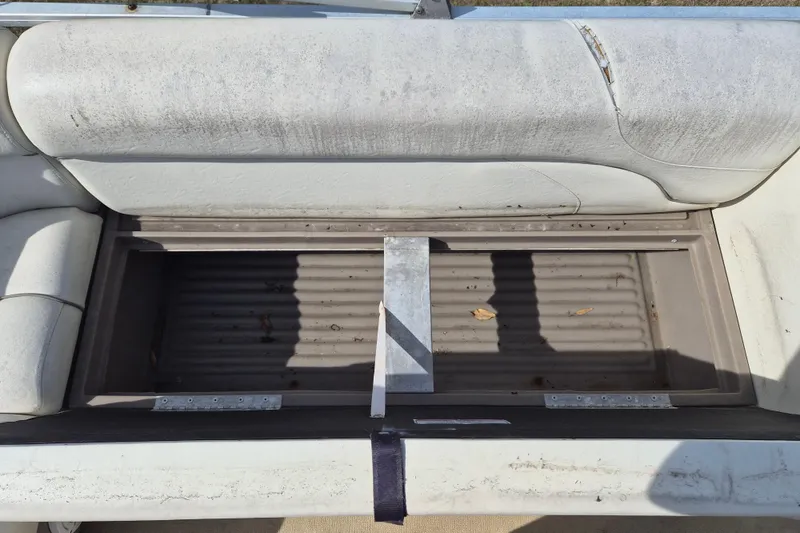 Slide: The Image of Open storage compartment on a 2004 Sun Tracker Fishin' Barge 20 DLX boat seat. - 8