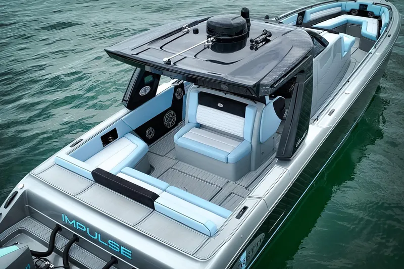 Slide: The Image of 2026 Cigarette 41' Nighthawk luxury boat on water, sleek design, spacious seating. - 10
