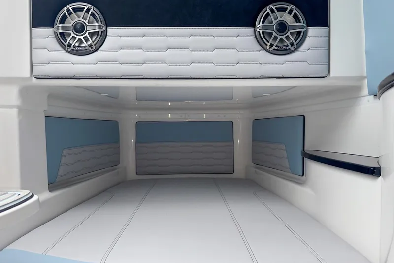 Slide: The Image of Interior cabin of 2026 Cigarette 41' Nighthawk boat with modern design and speakers. - 12