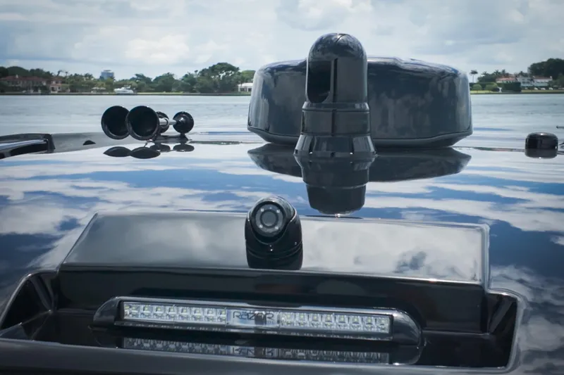 Slide: The Image of 2026 Cigarette 41' Nighthawk boat with advanced navigation equipment on a reflective surface. - 16