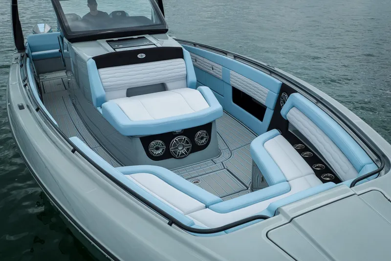 Slide: The Image of 2026 Cigarette 41' Nighthawk boat with luxurious seating on calm water. - 4