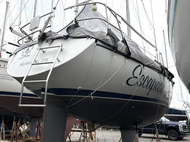 Slide: The Image of 1988 Ericson 34-2 sailboat named Escapade on a boatyard. - 14