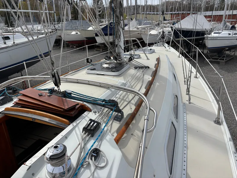 Slide: The Image of 1988 Ericson 34-2 sailboat in dry dock, covered. - 16