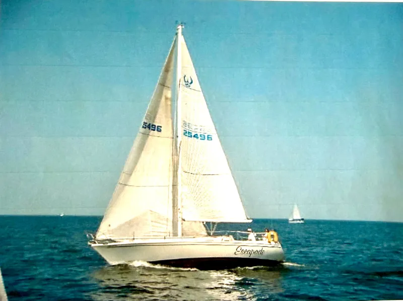Slide: The Image of 1988 Ericson 34-2 sailboat cruising on open sea. - 2
