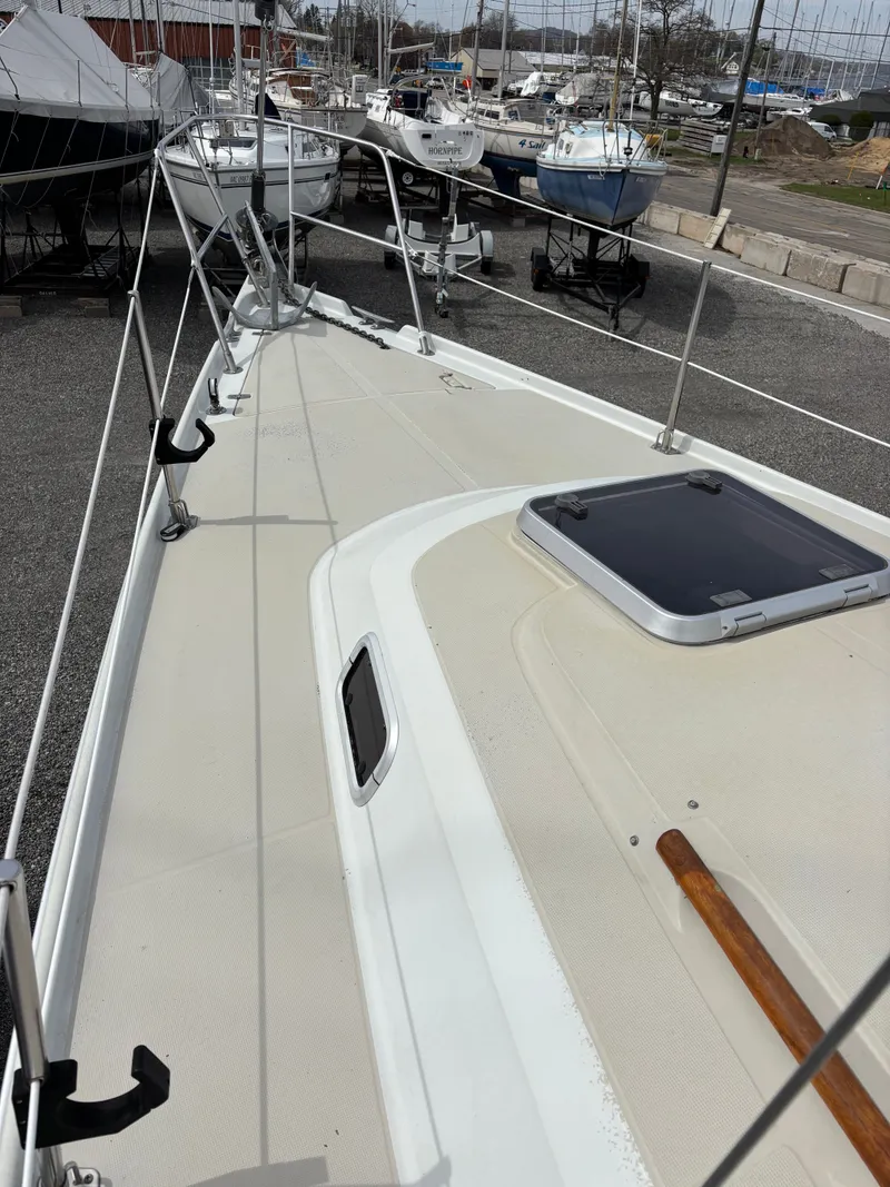 Slide: The Image of 1988 Ericson 34-2 sailboat docked in marina. - 25