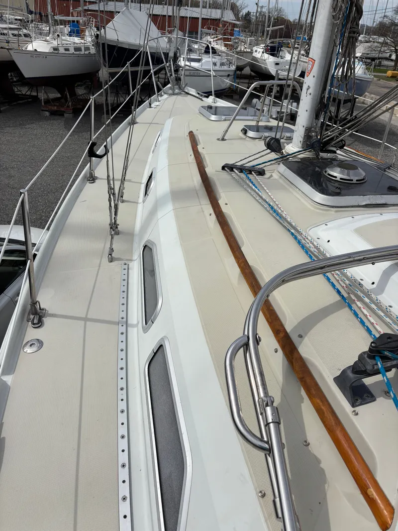 Slide: The Image of Deck of a 1988 Ericson 34-2 sailboat in harbor. - 26