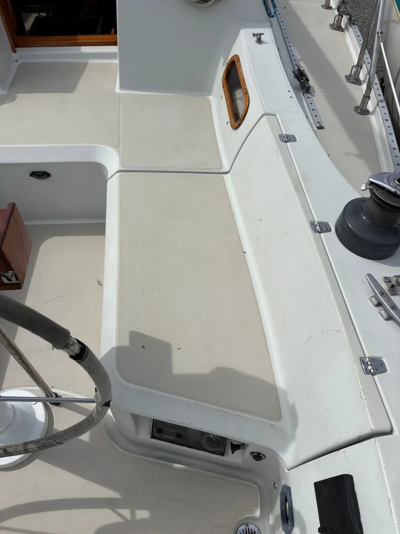 Slide: The Image of Cockpit of a 1988 Ericson 34-2 sailboat with steering wheel. - 32