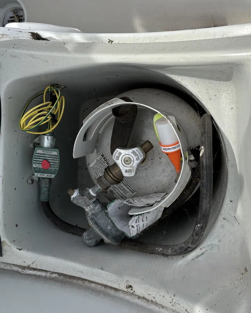 Slide: The Image of Interior of a 1988 Ericson 34-2 boat with tools and cables. - 44