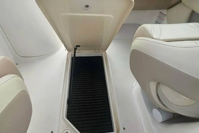 Slide: The Image of Open storage compartment in 2003 Chaparral Sunesta 236 boat interior. - 12