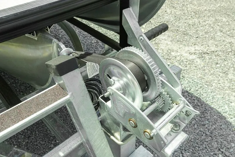 Slide: The Image of Boat trailer winch mechanism on a 2026 Dockside 22DF, featuring durable metal gears. - 10