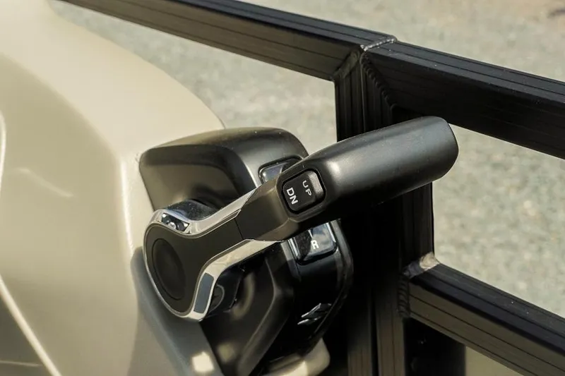 Slide: The Image of Throttle control lever on 2026 Dockside 22DF boat, featuring up and down buttons. - 17
