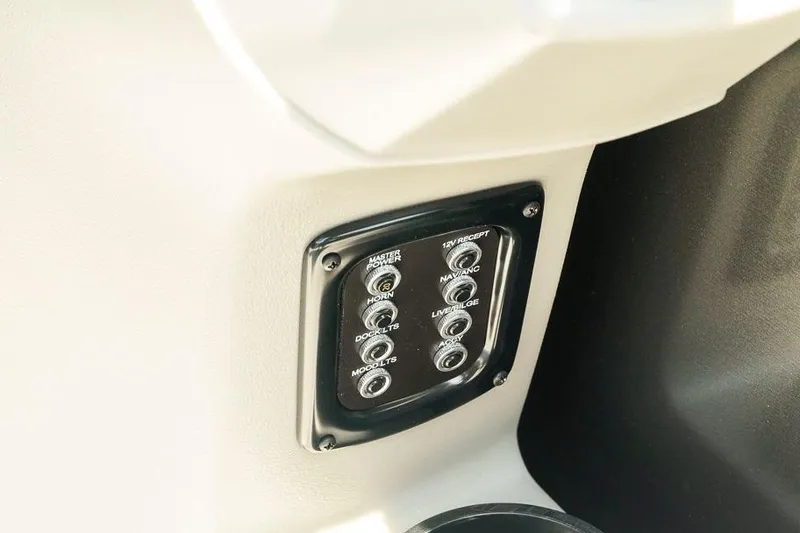 Slide: The Image of Control panel on Dockside 22DF boat, 2026 model, featuring various switches. - 18