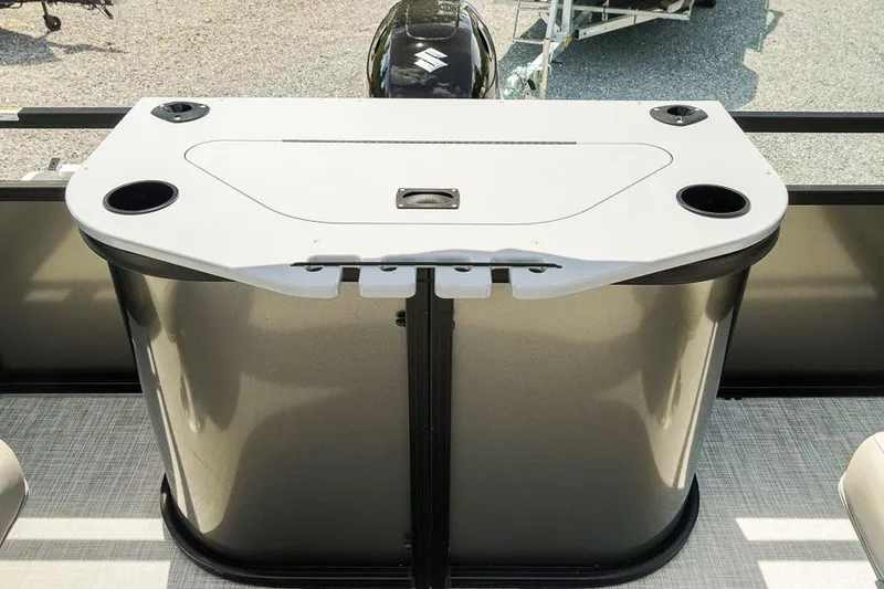 Slide: The Image of 2026 Dockside 22DF boat console with cup holders and sleek design. - 19