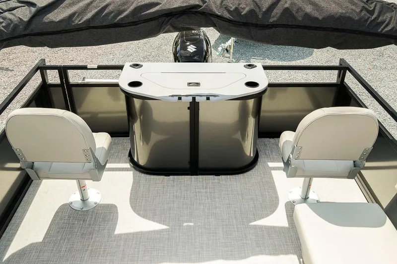 Slide: The Image of 2026 Dockside 22DF boat interior with two seats and a central console. - 22