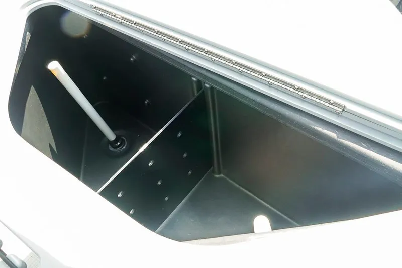 Slide: The Image of Open storage compartment of Dockside 22DF boat, 2026 model, with interior view. - 24