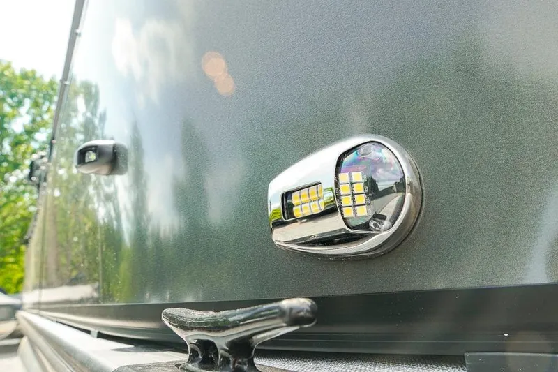 Slide: The Image of Close-up of a 2026 Dockside 22DF boat's LED light and cleat on a sunny day. - 30