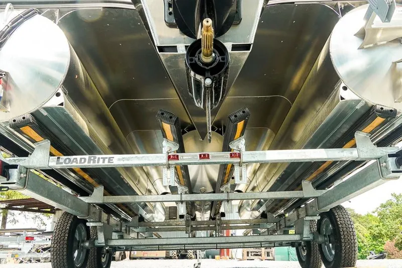 Slide: The Image of Underneath view of a 2026 Dockside 22DF boat on a LoadRite trailer. - 32