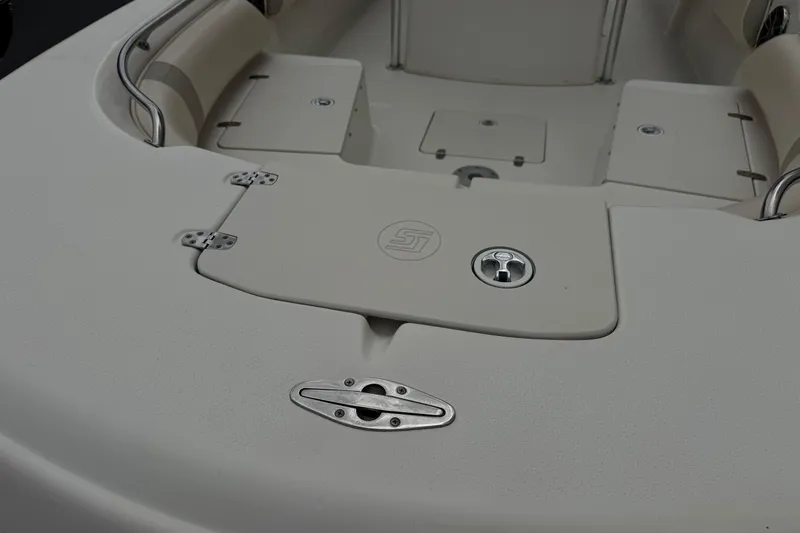 Slide: The Image of 2014 Carolina Skiff 23 Ultra Elite SS boat deck with storage compartments. - 10