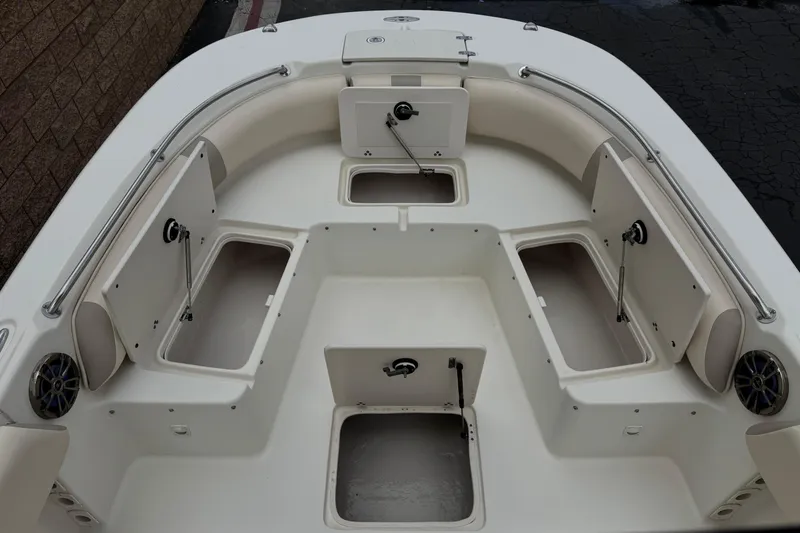 Slide: The Image of 2014 Carolina Skiff 23 Ultra Elite SS boat interior with open storage compartments. - 13
