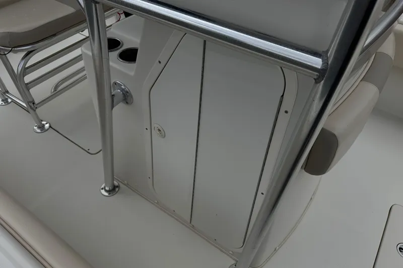 Slide: The Image of 2014 Carolina Skiff 23 Ultra Elite SS interior with seating and storage compartment. - 19